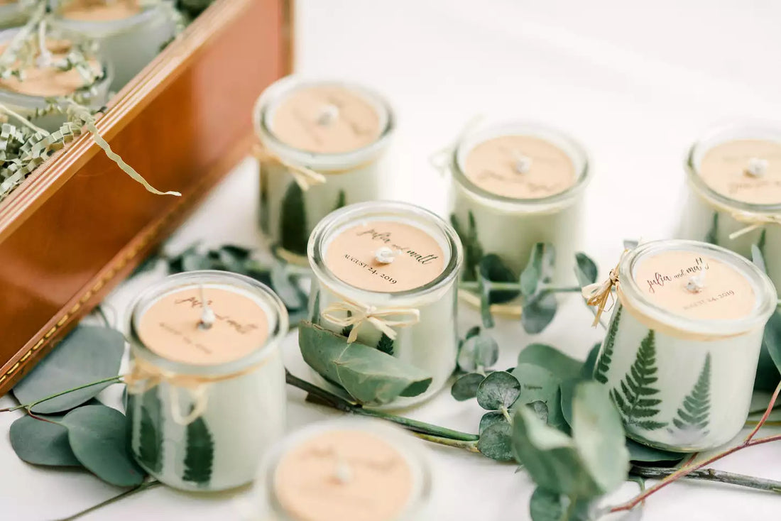 wedding favor candles with eucalyptus leaves