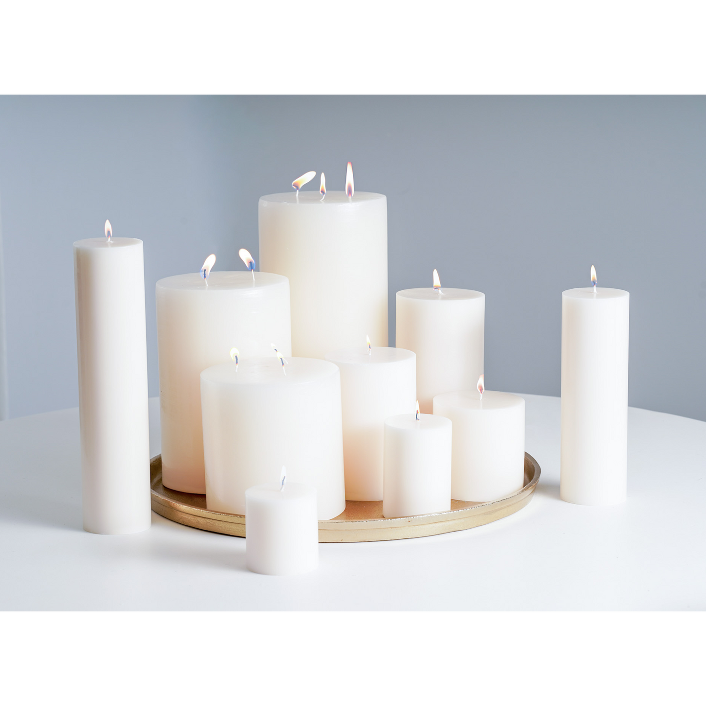 white pillar candles lit for elegant decor