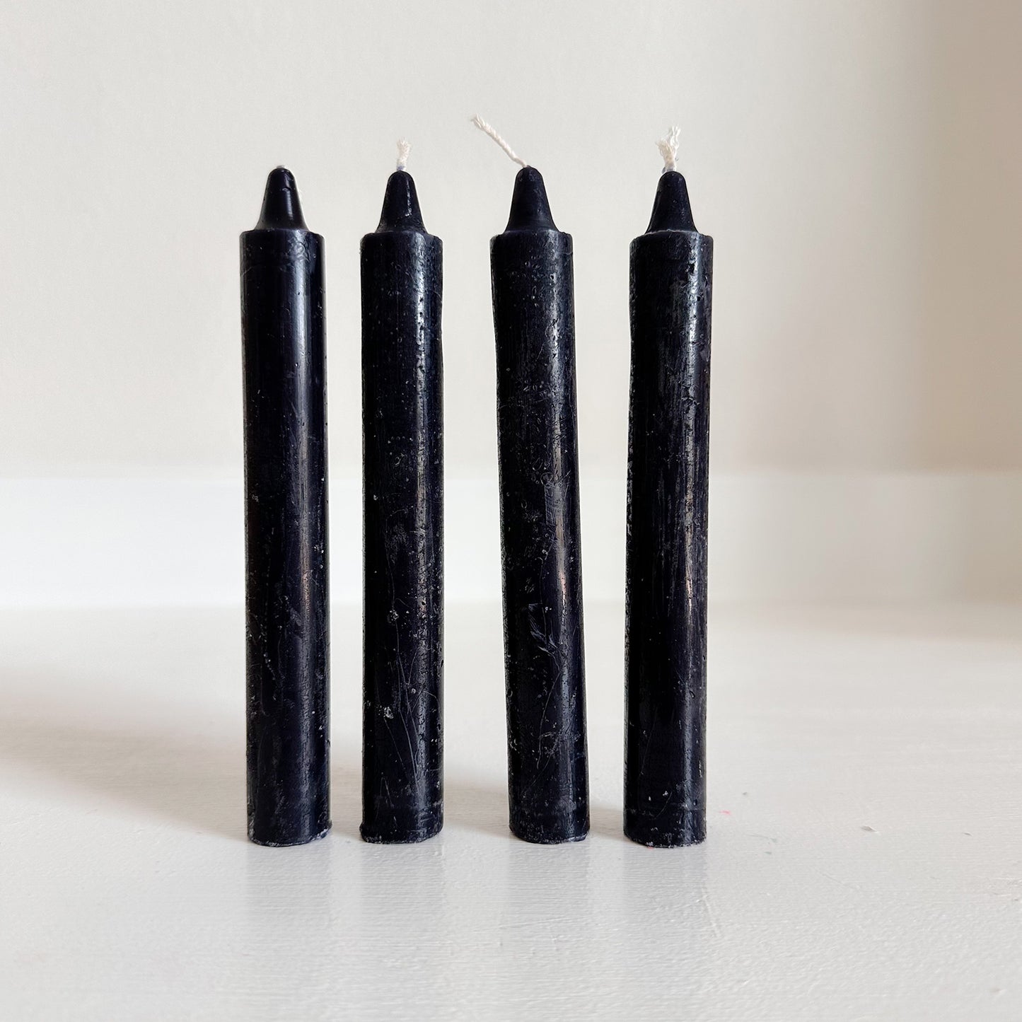 cylindrical household candles black