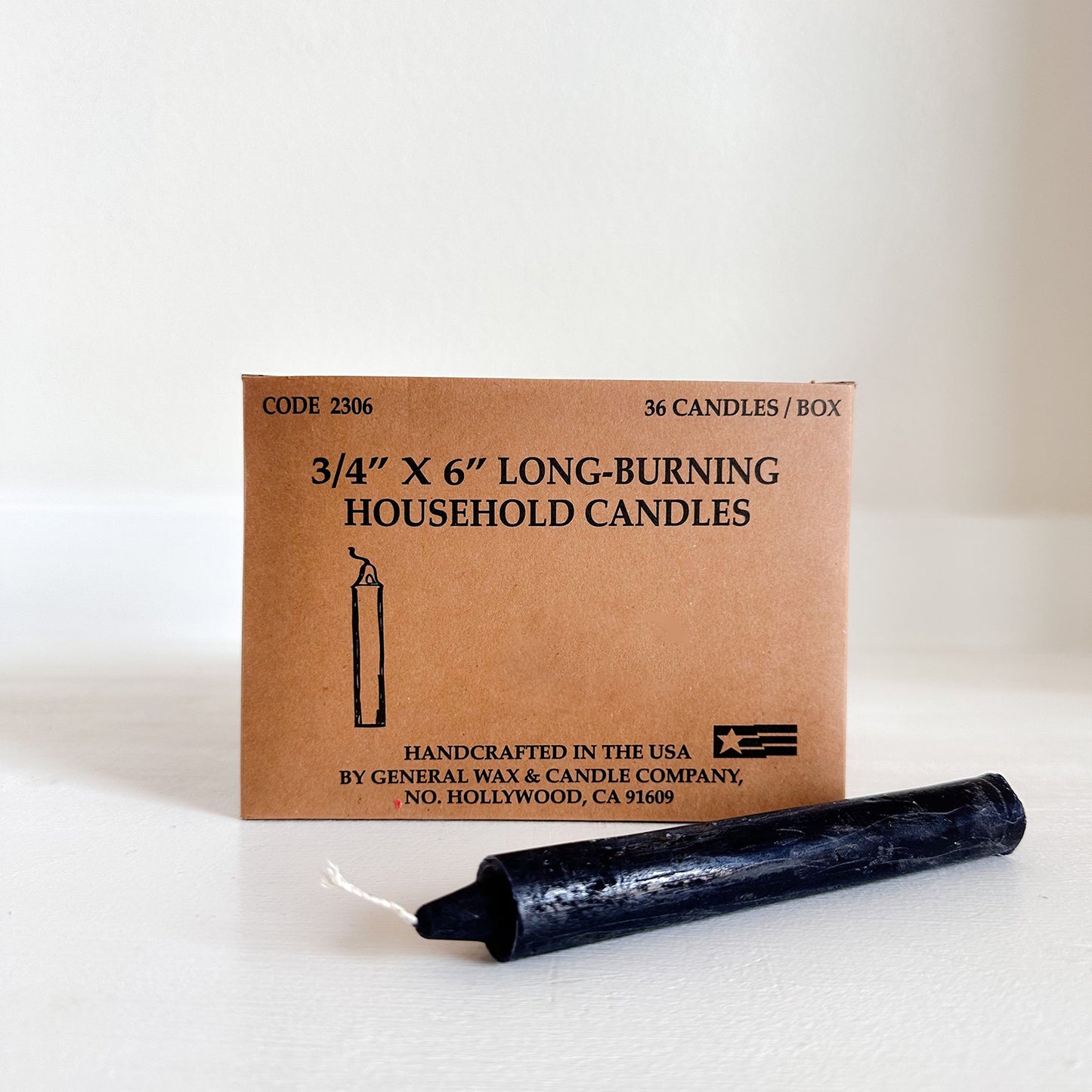 Box of long-burning black household candles