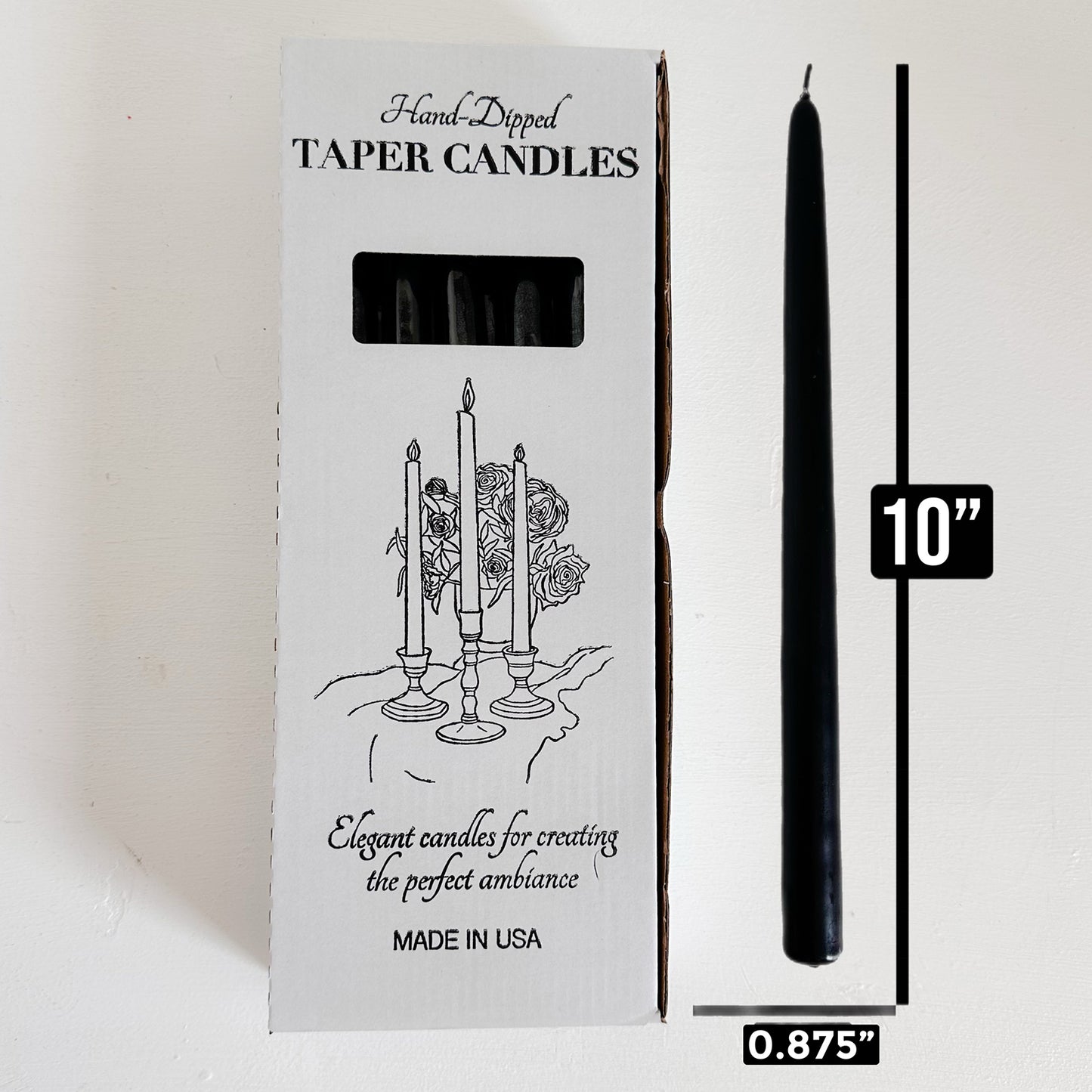 Black taper candle next to its packaging with dimensions