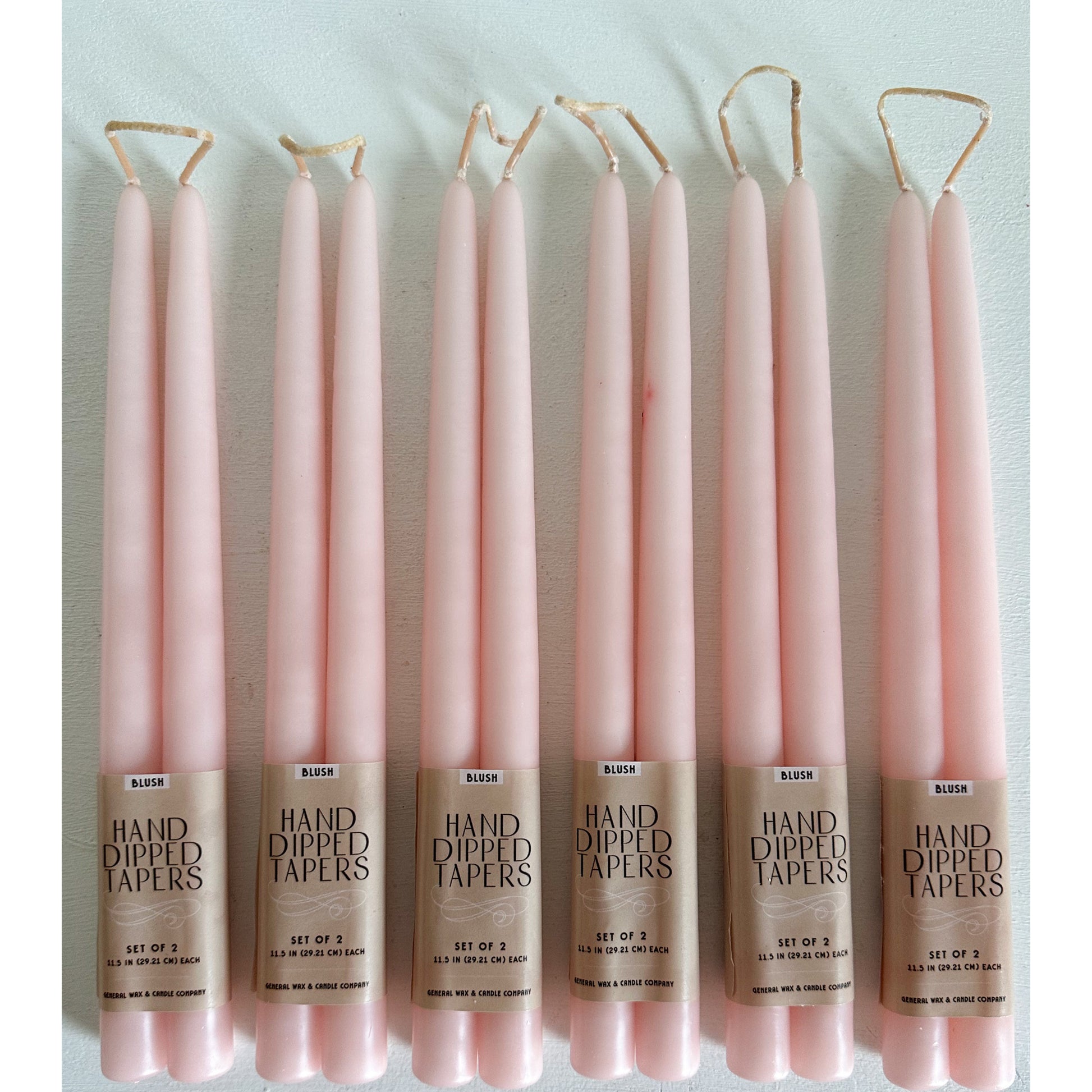 Blush taper candles for weddings and upscale events