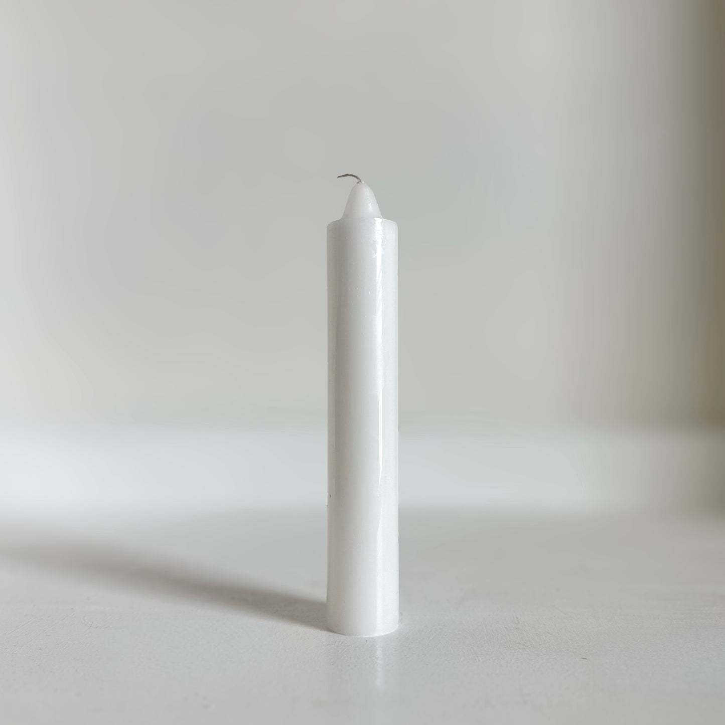 Long burning unscented Jumbo Candles on display