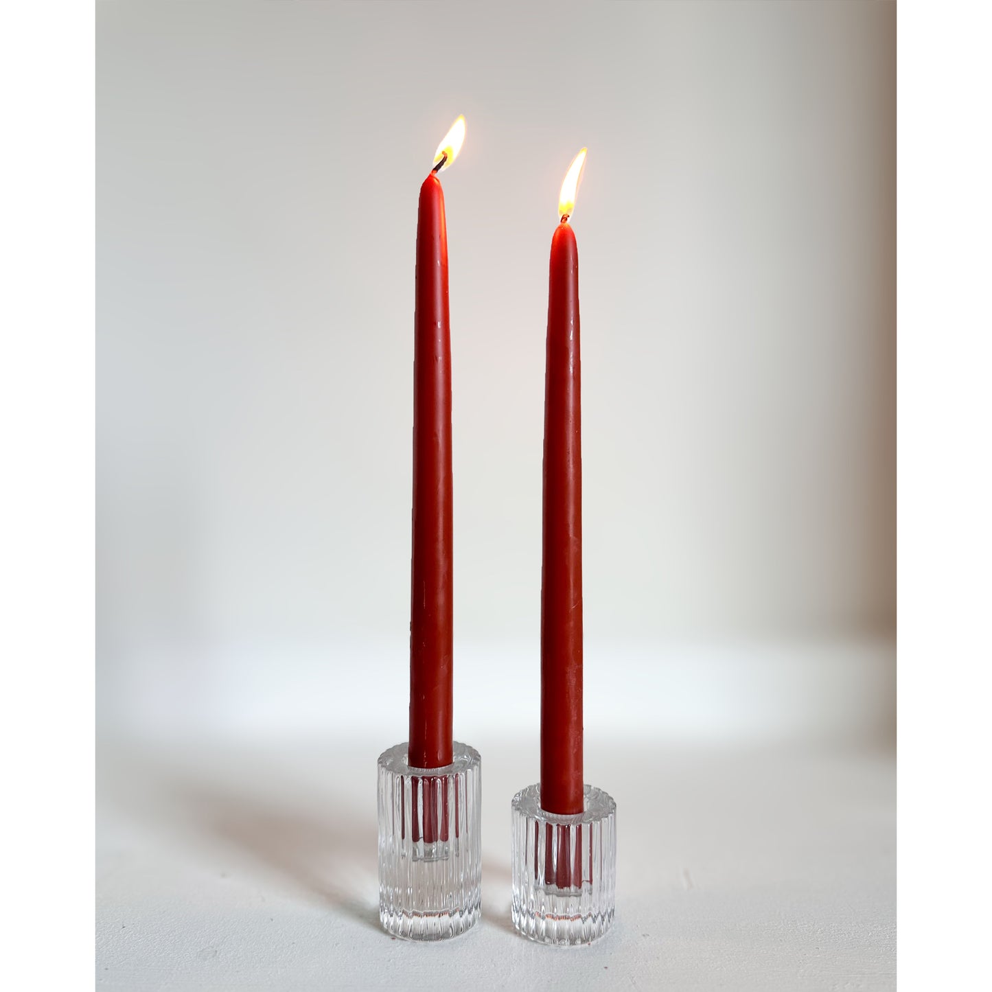 classic burgundy taper candles in glass holders