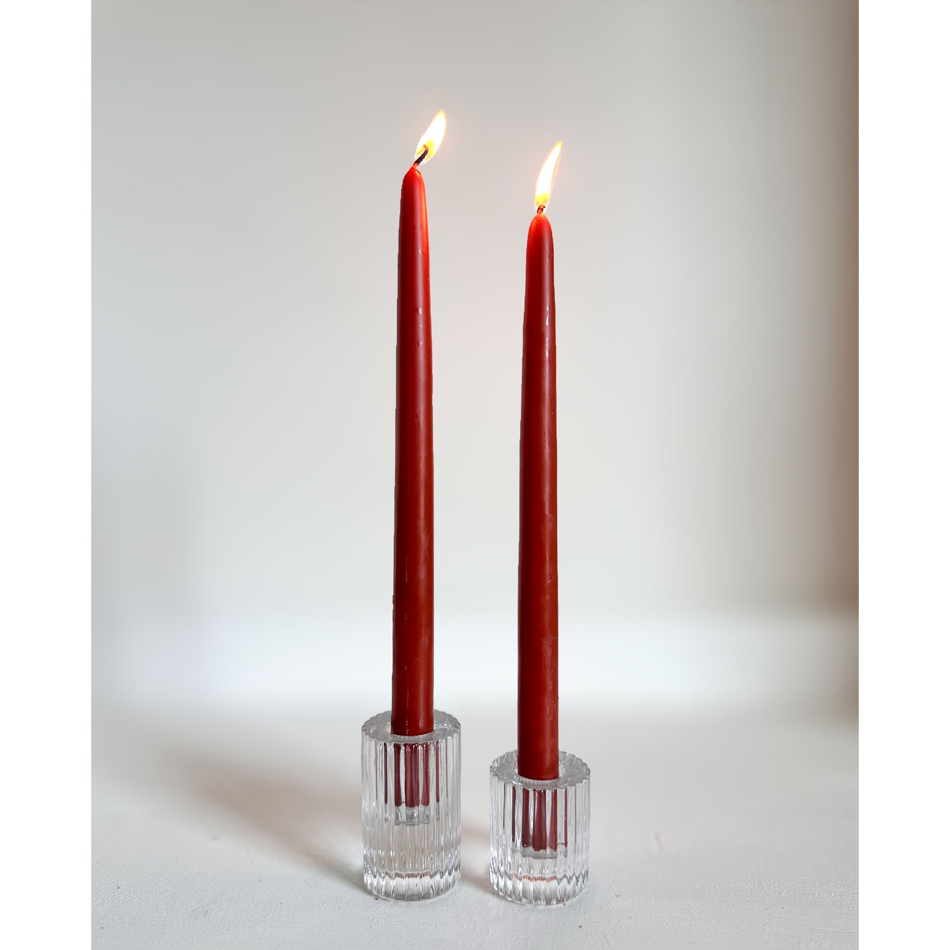 classic burgundy taper candles in glass holders