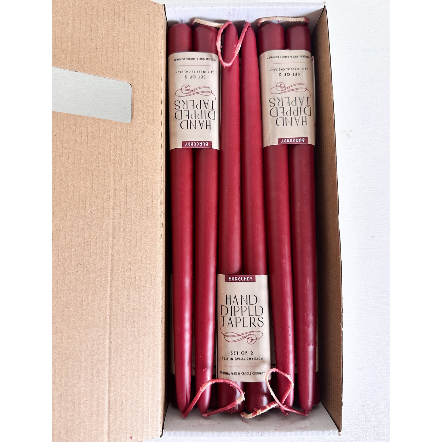 elegant burgundy taper candles with wick bridge