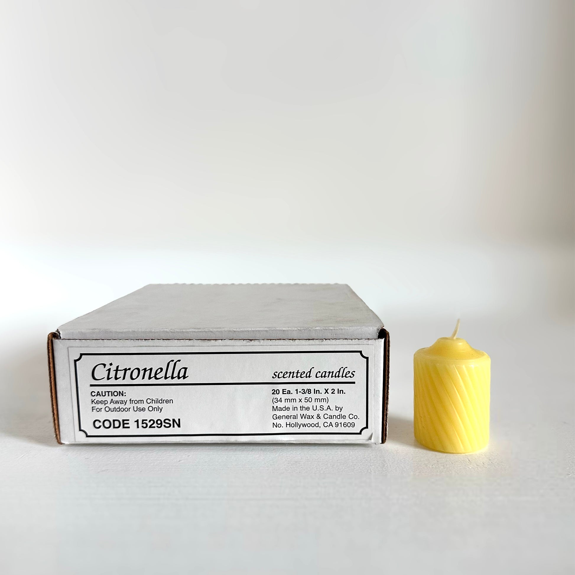 yellow votive candle Scentinella 15-hour burn