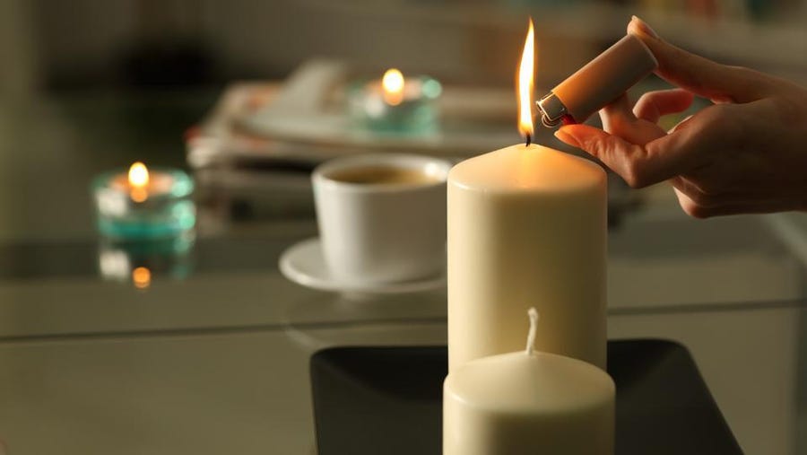 two pillar candles on the tray