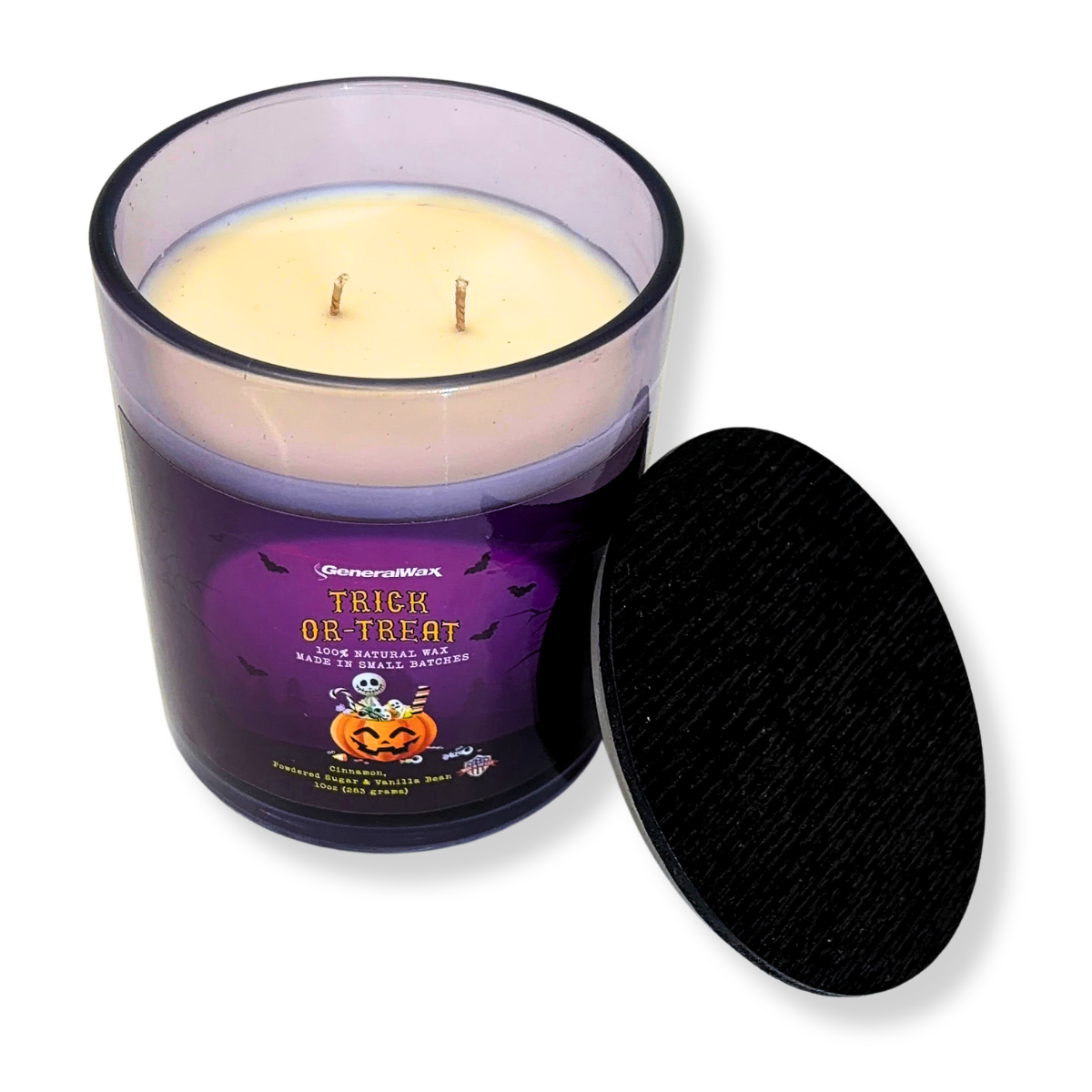 Trick-Or-Treat scented candle in a violet glass jar with Halloween candy bucket artwork