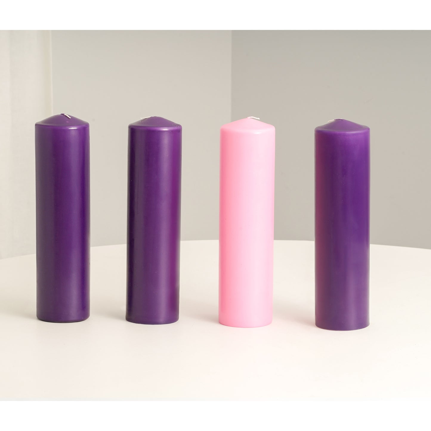 pink and purple pillar candles