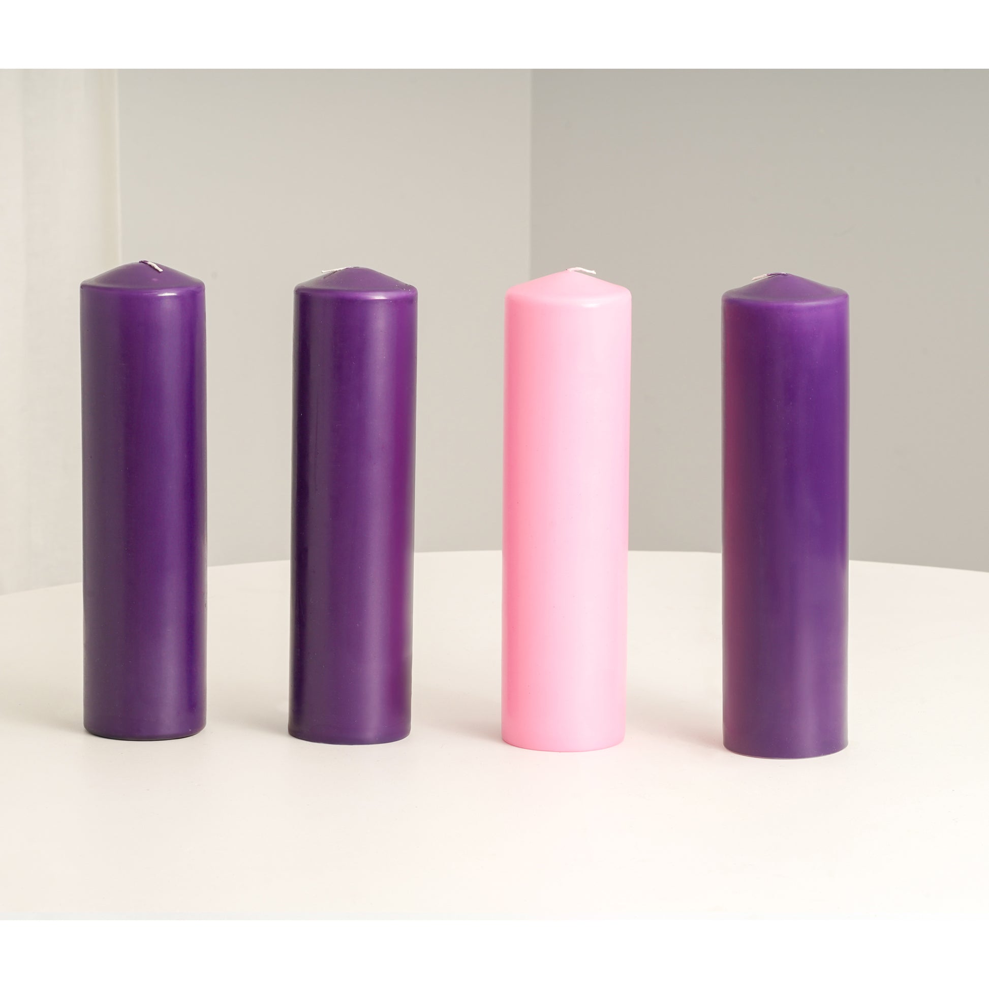pink and purple pillar candles